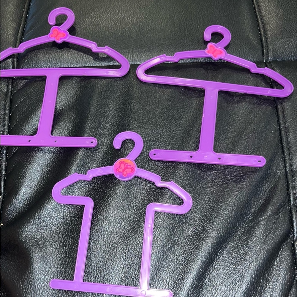 Purple plastic doll clothes hangers lot